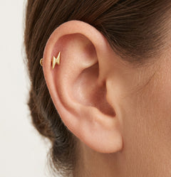 Elegant gold thunder design piercing