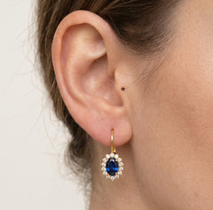 Yellow gold sapphire oval halo drop earrings