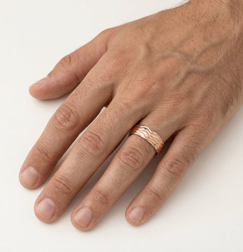 Rose gold wedding ring with wave lines
