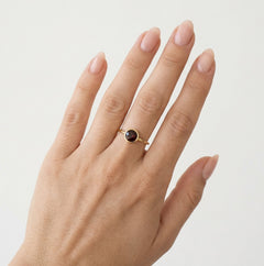 Elegant garnet round fine step cut women ring