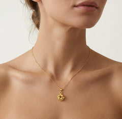 Yellow gold high polished knot pendant