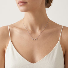 Silver infinity necklace with zircons