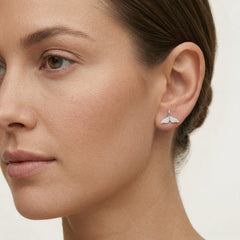 Silver earring fin of a whale