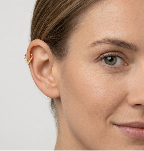 Stylish V end hoop piercing in yellow gold