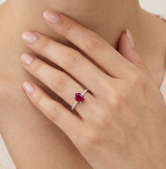 White gold ring with oval ruby and diamonds