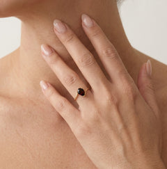 Graceful pear cut garnet in 14kt gold
