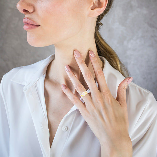 Cushion ring with gold and diamonds