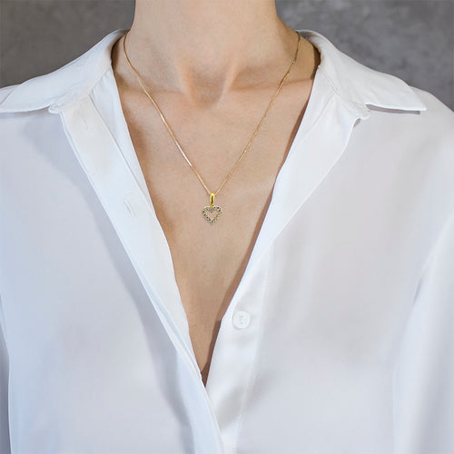 Petit cœur en or avec pierres de zircone cubique brillantes