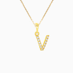 Gold pendant of letter V with zirconsPendente de oro con la letra V y circonitas
