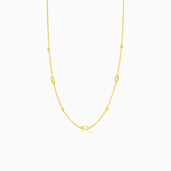 Gold necklace with balls and rectangular zircons