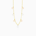 Gold necklace with two-colored hearts