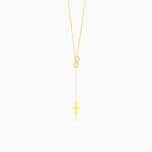 Goldene Halskette mit Unendlichkeitssymbol und Kreuz
