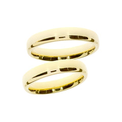 Anillo de boda elegante y ancho de oro amarillo