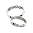 Modern white gold wedding ring with engravings lines