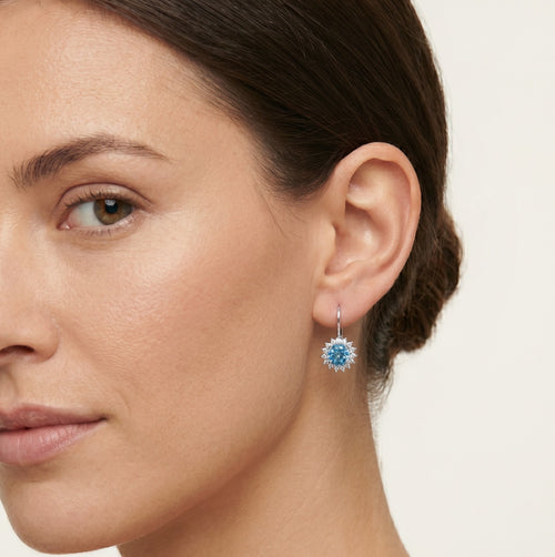 Halo sterling silver drop earrings with blue topaz