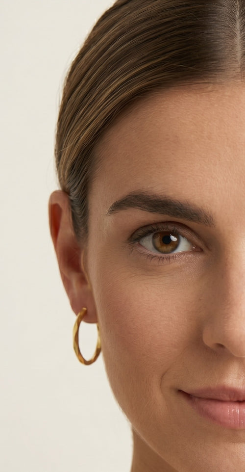 Twisted yellow gold hoop earrings