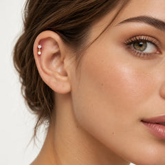 Piercing en or avec perle et zircone