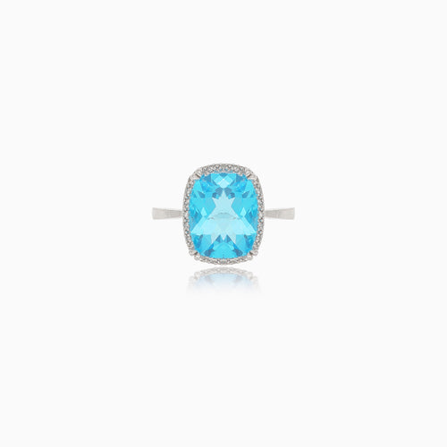 Bright white gold ring with topaz and diamonds