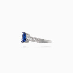 Stylish women's ring with diamonds and blue sapphire