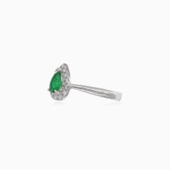 Elegant white gold women's ring with diamonds and emerald