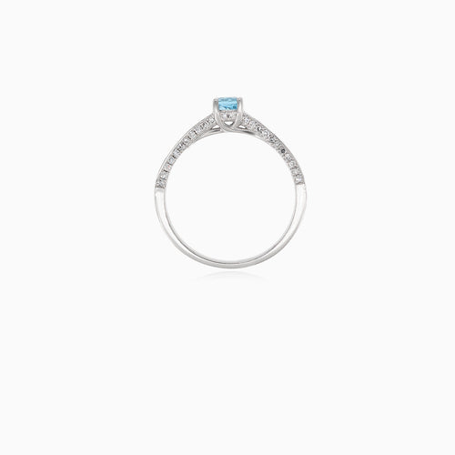 Elegant white gold ring with diamond and blue topaz