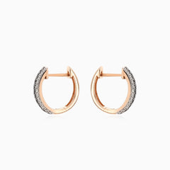 Shiny rose gold earrings with black and white diamonds