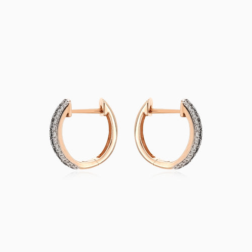 Shiny rose gold earrings with black and white diamonds