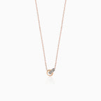 Diamond necklace with two intertwined rings