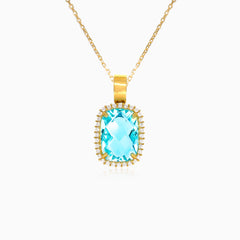 Pendentif halo en or jaune avec topaze bleue taille coussin