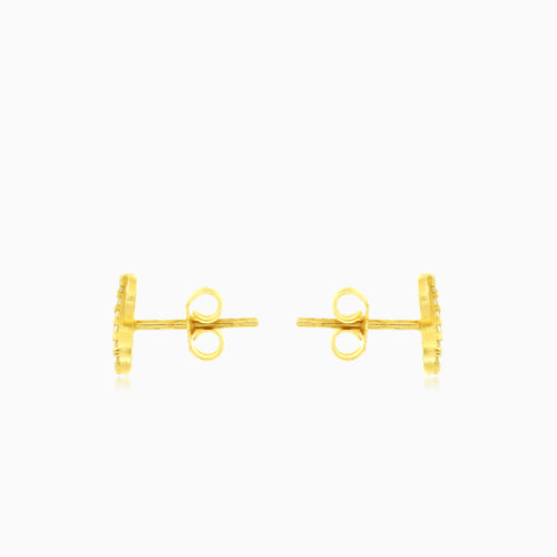 Goldene Ohrstecker mit unendlichen Zirkonia
