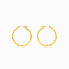 Twisted yellow gold hoop earrings