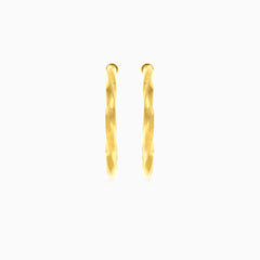 Twisted yellow gold hoop earrings