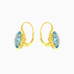 Zlaté náušnice s oválným modrým topazem