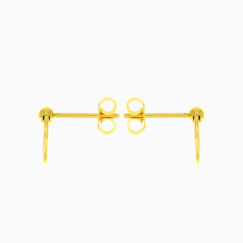 Gelbgoldene Kreis-Ball-Ohrringe.