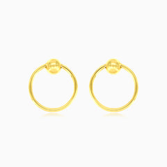 Gelbgoldene Kreis-Ball-Ohrringe.