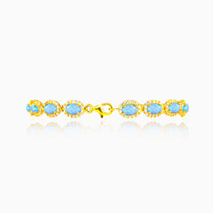 Bracelet en or jaune avec opale bleu royal