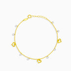 Chain bracelet with dangling hearts and stones