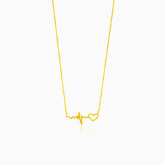 Gold necklace with heartbeat symbol