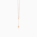 Collier unique en or rose avec croix et symbole de l'infini
