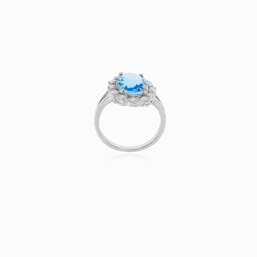 Halo silver blue topaz and cubic zirconia ring