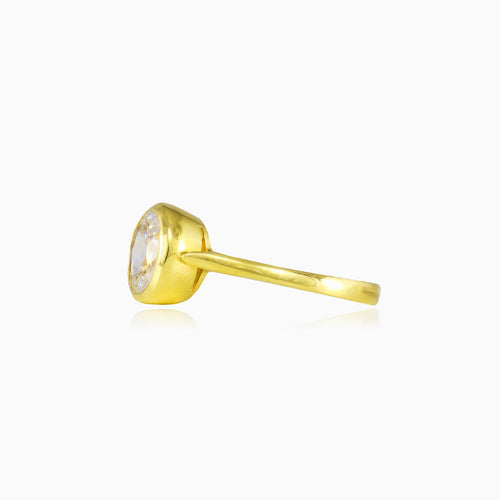 Bezel set oval crystal gold ring