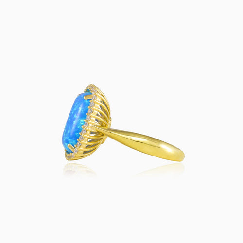 Massive cabochon blue opal gold ring