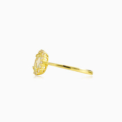 Oval topaz halo gold ring