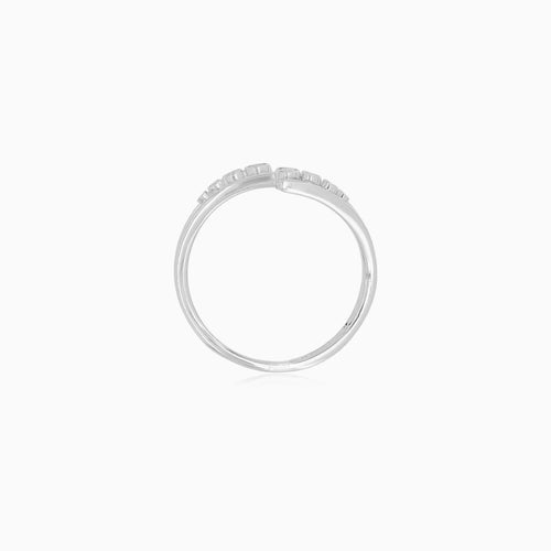 Diamond crossover ring in 18k white gold
