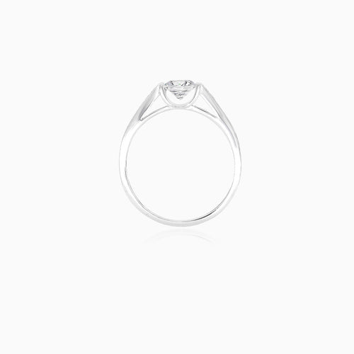 White gold ring with exposed cubic zirconia and side zircons