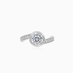 White gold bezel cubic zircon ring with accent zircons