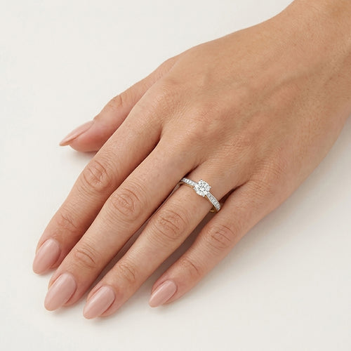 Elegant yellow gold diamond ring with pavé