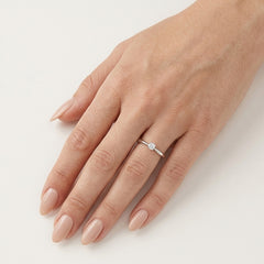 Petite solitaire engagement ring