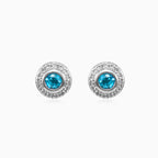 White gold stud earrings with sapphire and diamond halo