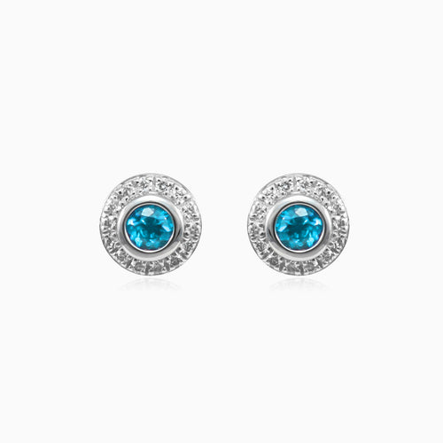 White gold stud earrings with sapphire and diamond halo